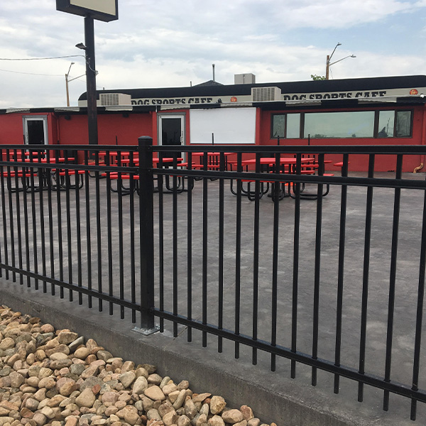 A black metal fence around restaurant