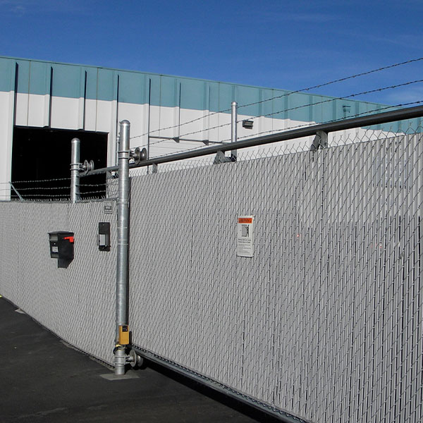Security fence in front of warehouse